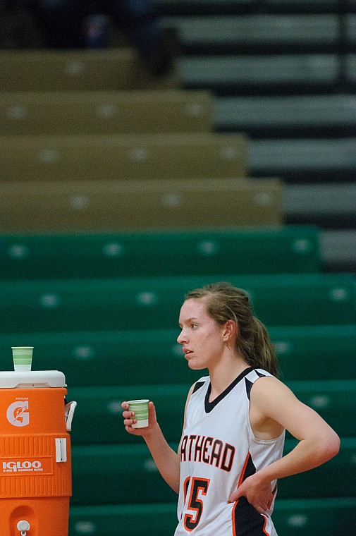 &lt;p&gt;Flathead senior Emily Russell (15) watches the game as she gets a drink Thursday night during Flathead's matchup against Great Falls High in the first round of the Class AA State Championship in Great Falls. Thursday, March 7, 2013 in Great Falls, Montana. (Patrick Cote/Daily Inter Lake)&lt;/p&gt;