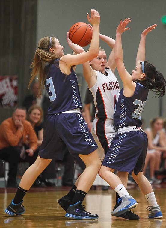 &lt;p&gt;Flathead senior Dani Davis (11) looks to pass the ball Thursday night during Flathead's matchup against Great Falls High in the first round of the Class AA State Championship in Great Falls. Thursday, March 7, 2013 in Great Falls, Montana. (Patrick Cote/Daily Inter Lake)&lt;/p&gt;