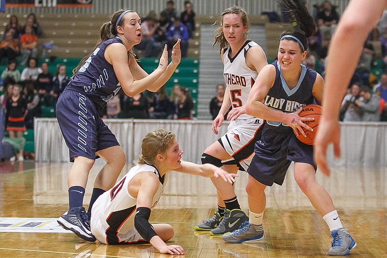 &lt;p&gt;Flathead junior Emma Andrews (floor) reaches for the ball controlled by a Great Falls High player Thursday night in the first round of the Class AA state basketball tournament in Great Falls.&#160;&lt;/p&gt;