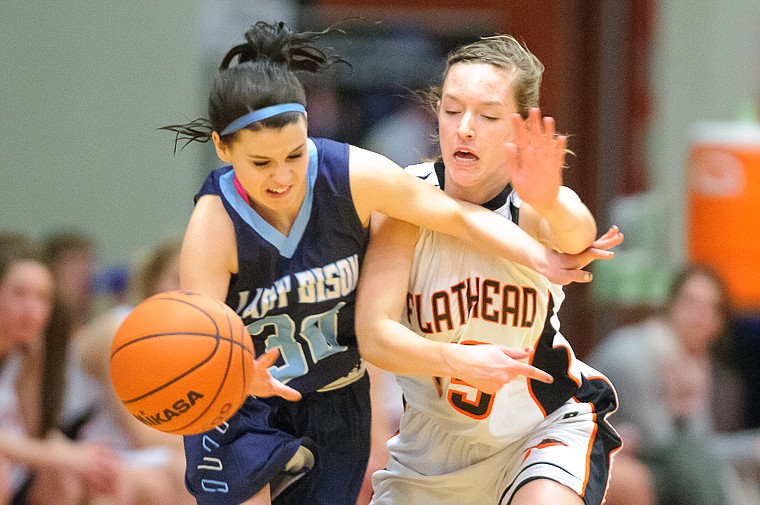 &lt;p&gt;Flathead senior Emily Russell (15) tips the ball away from Great Falls' Taylor Kumm (30) Thursday night during Flathead's matchup against Great Falls High in the first round of the Class AA State Championship in Great Falls. Thursday, March 7, 2013 in Great Falls, Montana. (Patrick Cote/Daily Inter Lake)&lt;/p&gt;