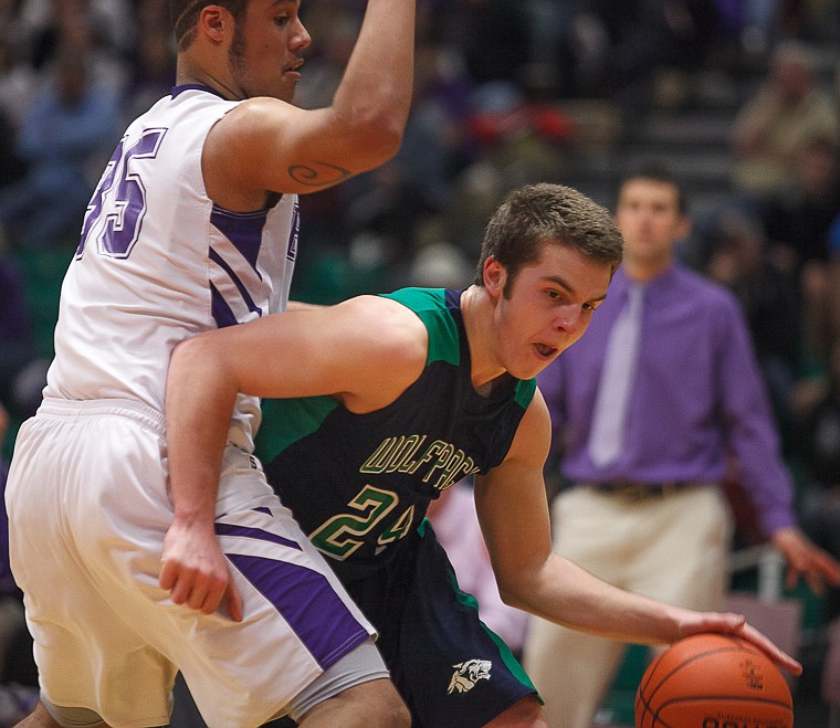 &lt;p&gt;Glacier senior forward Logan Iverson (24) drives around a defender Thursday morning during Glacier's matchup against Butte in the first game of the Class AA State Championship in Great Falls. Thursday, March 7, 2013 in Great Falls, Montana. (Patrick Cote/Daily Inter Lake)&lt;/p&gt;