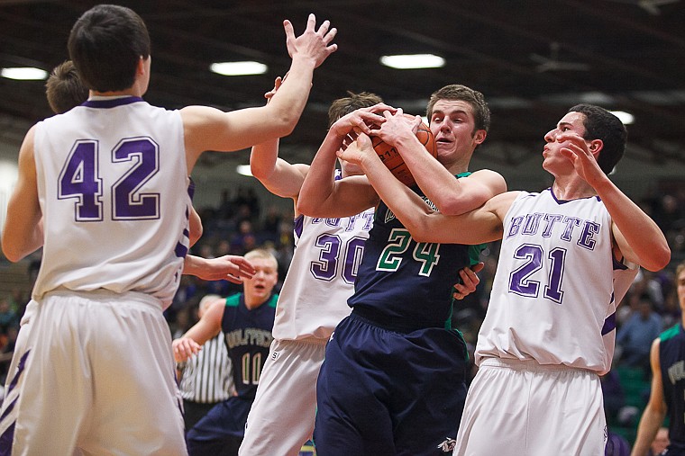 &lt;p&gt;Glacier senior forward Logan Iverson (24) fights for a loose ball Thursday morning during the first half of Glacier's matchup against Butte in the first game of the Class AA State Championship in Great Falls. Thursday, March 7, 2013 in Great Falls, Montana. (Patrick Cote/Daily Inter Lake)&lt;/p&gt;