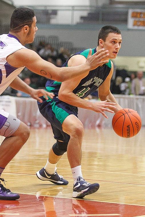 &lt;p&gt;Glacier senior guard Kyle Griffith (4) drives past a defender Thursday morning during Glacier's matchup against Butte in the first game of the Class AA State Championship in Great Falls. Thursday, March 7, 2013 in Great Falls, Montana. (Patrick Cote/Daily Inter Lake)&lt;/p&gt;