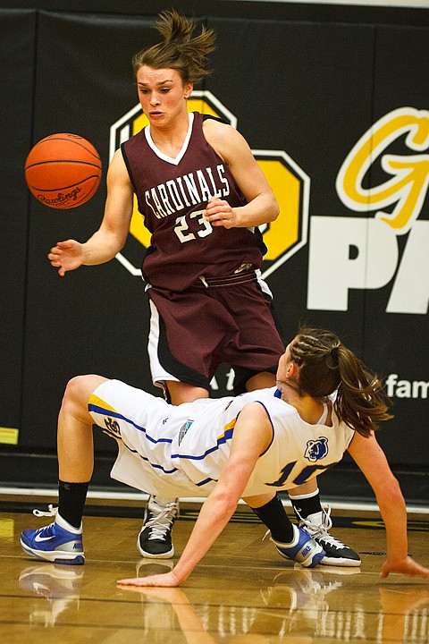 SHAWN GUST/Press

North Idaho College's Korina Baker causes a turnover after Marissa Robbins, of Salt Lake Community College, looses her footing.