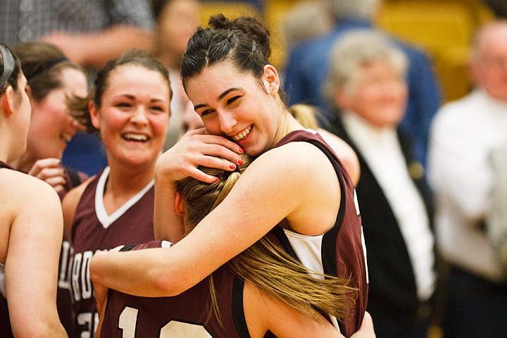 SHAWN GUST/Press

North Idaho College's Tugce Canitez hugs a team mate after the lady Cardinals won the Region 18 championship to advance to the national basketball tournament.