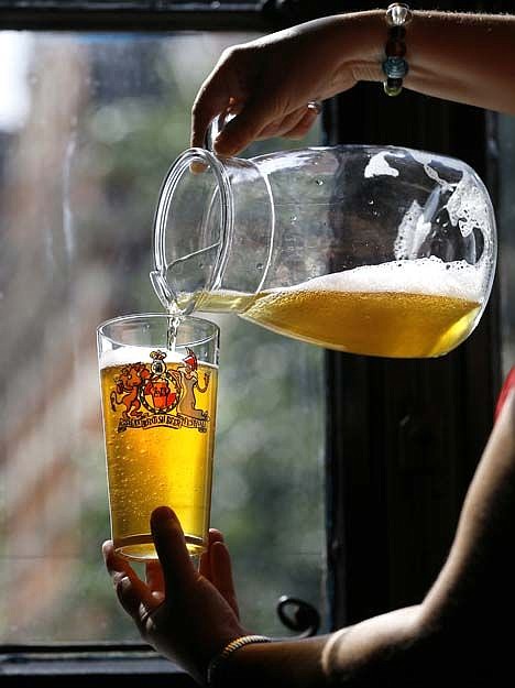 &lt;p&gt;A volunteer pours beer during a tasting session at the Great British Beer Festival in London, Aug. 13, 2013.&lt;/p&gt;