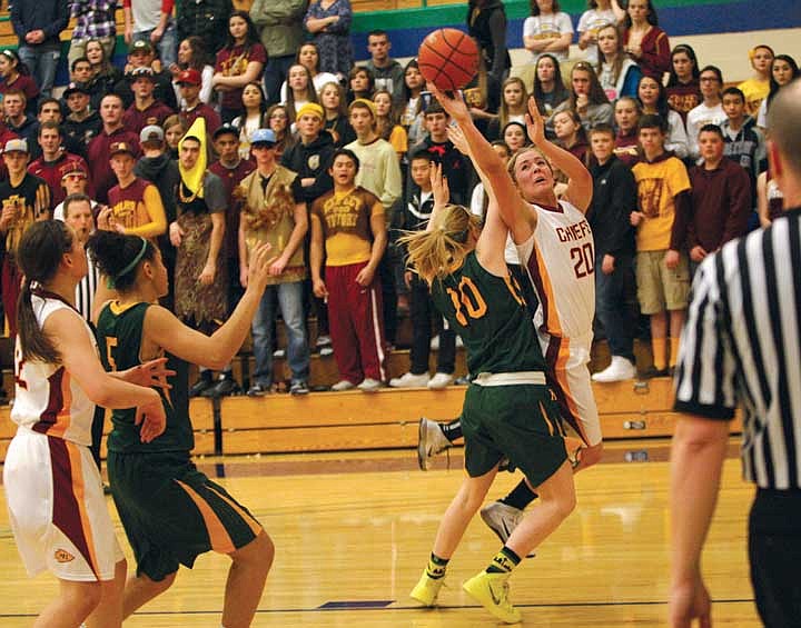 Junior guard McKenna Walker (20) attempts a lay up against a Kentridge defender. Walker also scored 14 points against the Chargers.