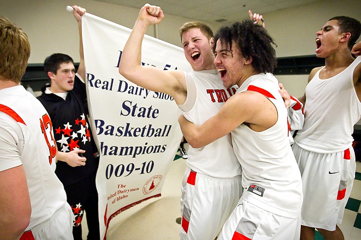 &lt;p&gt;Post Falls High's Jared Kennedy, Marcus Colbert and Shawn Reid celebrate in the locker room with their team following the Trojan's first championship win since 1964 at the state 5A boys basketball championship game Saturday at the Idaho Center in Nampa.&lt;/p&gt;
