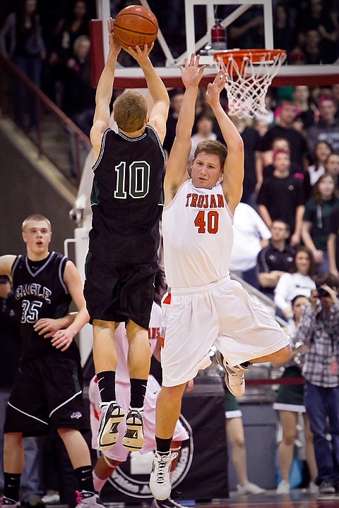 &lt;p&gt;Jared Kennedy from Post Falls High puts pressure on Eagle High's Thayne Pearson as he goes up for a shot in the second half.&lt;/p&gt;