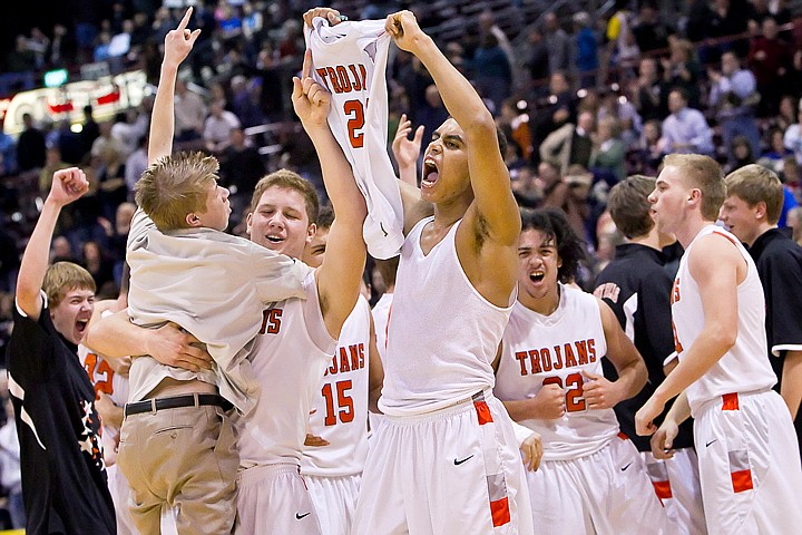 &lt;p&gt;Post Falls High's Shawn Reid celebrates his teams championship win while teammate Jared Kennedy lifts Anthony &quot;A-Train&quot; King during the jubilation Saturday following the game against Eagle High at the Idaho Center in Nampa. The win is the school's first boys basketball championship since 1964.&lt;/p&gt;