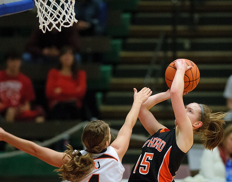 &lt;p&gt;Flathead senior Emily Russell (15) puts up a shot Friday afternoon during Flathead's matchup against Billings Senior on the second day of the Class AA state basketball tournament at Four Seasons Arena in Great Falls. Friday, March 8, 2013 in Great Falls, Montana. (Patrick Cote/Daily Inter Lake)&lt;/p&gt;