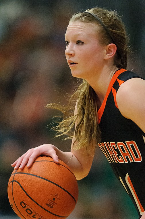 &lt;p&gt;Flathead senior Dani Davis (11) dribbles the ball Friday afternoon during Flathead's matchup against Billings Senior on the second day of the Class AA state basketball tournament at Four Seasons Arena in Great Falls. Friday, March 8, 2013 in Great Falls, Montana. (Patrick Cote/Daily Inter Lake)&lt;/p&gt;