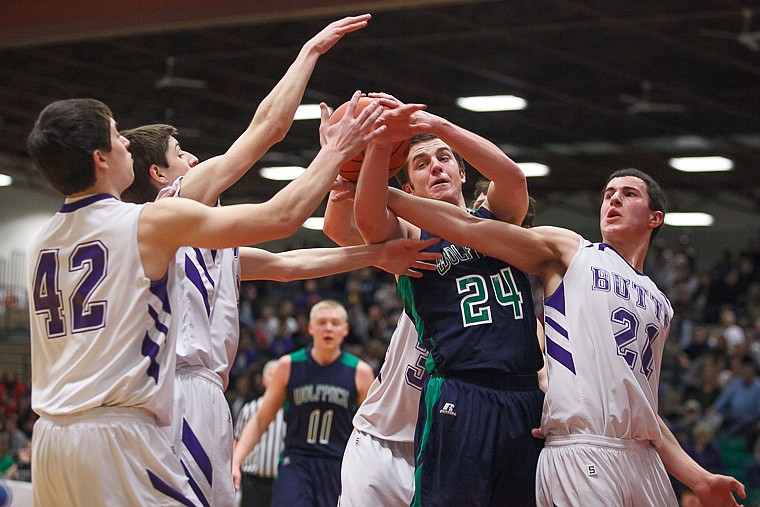 &lt;p&gt;Glacier senior forward Logan Iverson (24) fights for a loose ball Thursday morning during Glacier's matchup against Butte in the first game of the Class AA State Championship in Great Falls. Thursday, March 7, 2013 in Great Falls, Montana. (Patrick Cote/Daily Inter Lake)&lt;/p&gt;