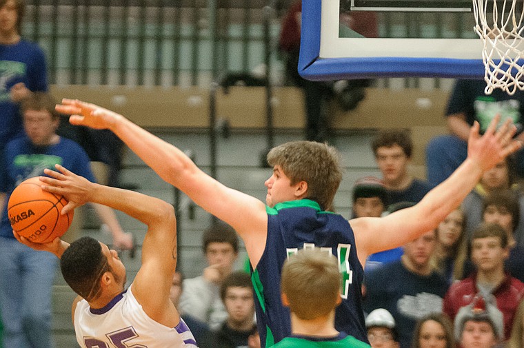 &lt;p&gt;Glacier senior post Ryan Edwards (44) tries to block a shot Thursday morning during the first half of Glacier's matchup against Butte in the first game of the Class AA State Championship in Great Falls. Thursday, March 7, 2013 in Great Falls, Montana. (Patrick Cote/Daily Inter Lake)&lt;/p&gt;