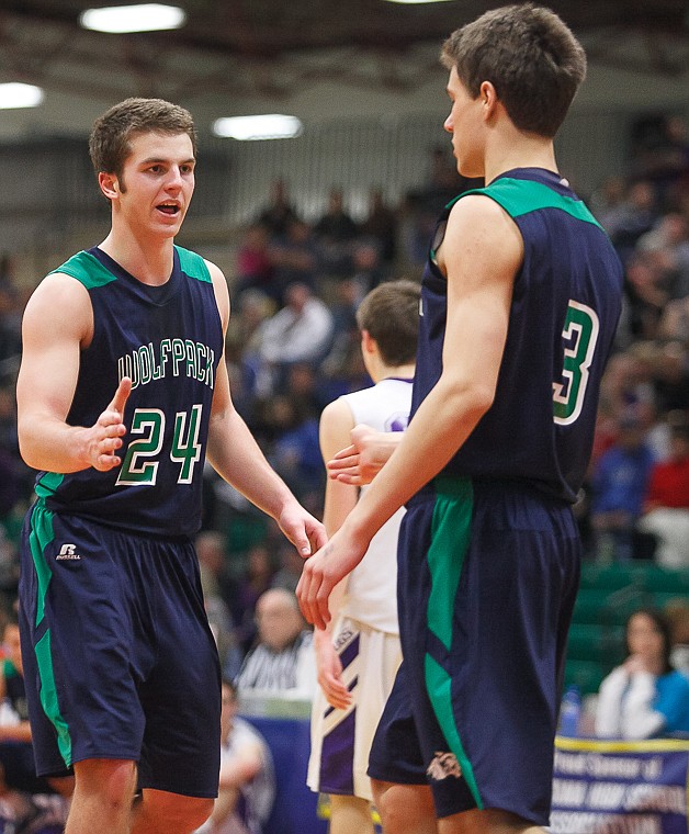 &lt;p&gt;Glacier senior forward Logan Iverson (24) slaps hands with Glacier senior guard Reid Siderius (3) Thursday morning during the first half of Glacier's matchup against Butte in the first game of the Class AA State Championship in Great Falls. Thursday, March 7, 2013 in Great Falls, Montana. (Patrick Cote/Daily Inter Lake)&lt;/p&gt;