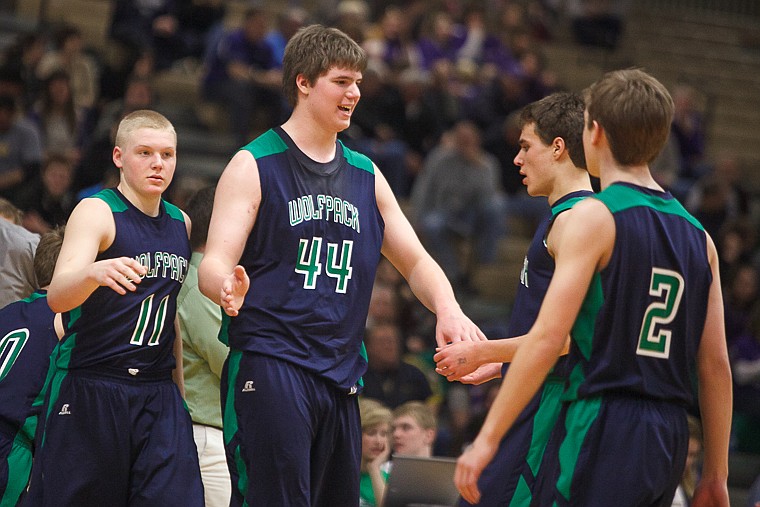 &lt;p&gt;Glacier senior post Ryan Edwards (44) slaps hands with teammates during a timeout Thursday morning during Glacier's matchup against Butte in the first game of the Class AA State Championship in Great Falls. Thursday, March 7, 2013 in Great Falls, Montana. (Patrick Cote/Daily Inter Lake)&lt;/p&gt;