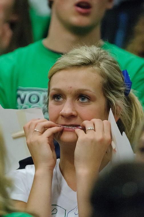 <p>A nervous fan watches the game Friday afternoon during Glacier's matchup against Hellgate on the second day of the Class AA state basketball tournament at Four Seasons Arena in Great Falls. Friday, March 8, 2013 in Great Falls, Montana. (Patrick Cote/Daily Inter Lake)</p>