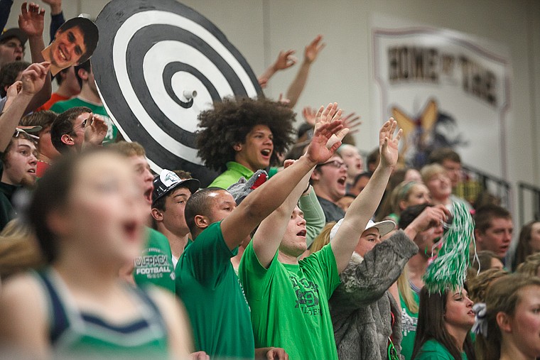 <p>The Glacier student section attempts to distract a free throw attempt Friday afternoon during Glacier's matchup against Hellgate on the second day of the Class AA state basketball tournament at Four Seasons Arena in Great Falls. Friday, March 8, 2013 in Great Falls, Montana. (Patrick Cote/Daily Inter Lake)</p>