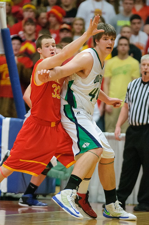 <p>Glacier senior post Ryan Edwards (44) works for position under the basket Friday afternoon during Glacier's matchup against Hellgate on the second day of the Class AA state basketball tournament at Four Seasons Arena in Great Falls. Friday, March 8, 2013 in Great Falls, Montana. (Patrick Cote/Daily Inter Lake)</p>