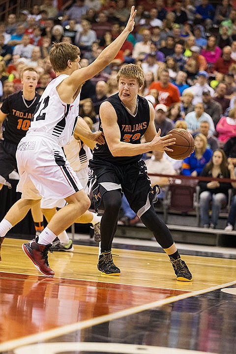 &lt;p&gt;Post Falls post Jack Millsap prepares to pass the ball around Highland defender Mav Woodward in the fourth quarter.&lt;/p&gt;