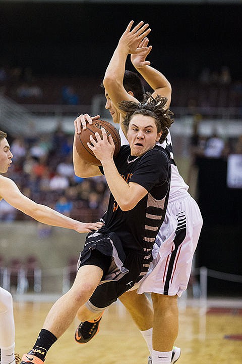 &lt;p&gt;Post Falls&#146; Max McCullough drives past Highland&#146;s Kyler Manu in the second quarter.&lt;/p&gt;