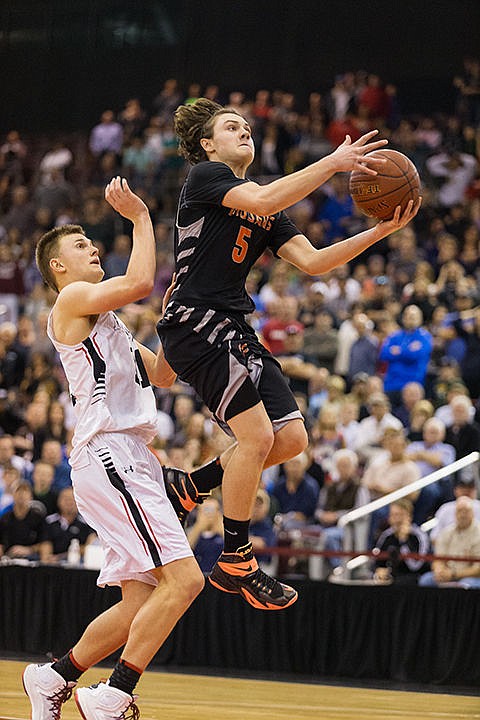 &lt;p&gt;Post Falls High&#146;s Max McCullough drives to the basket past Highland&#146;s Connor Harding during the second half.&lt;/p&gt;