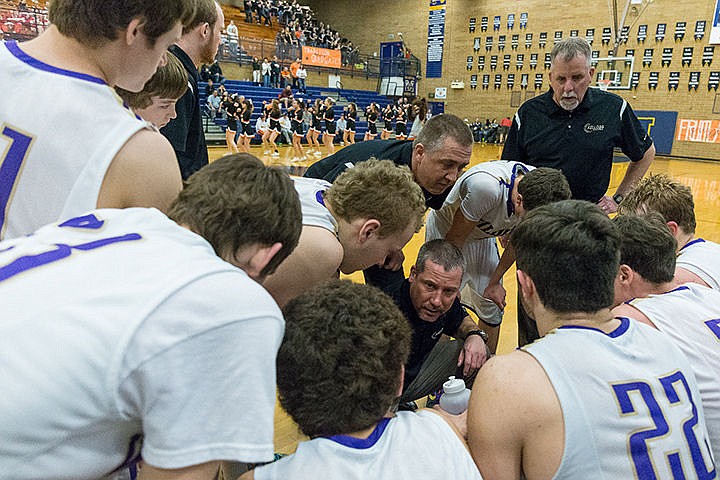 &lt;p&gt;Kellogg head basketball coach Jeff Lambert makes a plan with his team during a time-out in the fourth quarter.&lt;/p&gt;