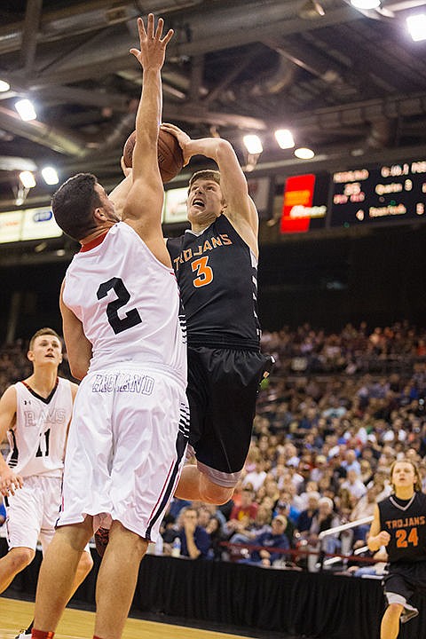 &lt;p&gt;Post Falls&#146; Wyatt Millsap takes a shot outside the key over Highland High&#146;s Stefan Gonzalez during the third quarter.&lt;/p&gt;