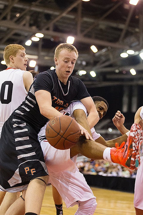 &lt;p&gt;Luke Anderson, a Post Falls guard, gets tangled with Highland&#146;s Jawan Frazier-Flores while trying to recover a rebound during the title game.&lt;/p&gt;