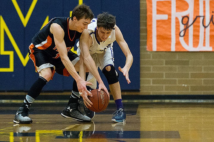 &lt;p&gt;Kellogg High School&#146;s Tobias Colburn scrambles for a loose ball against Fruitland High&#146;s Walker Whaley in the third period.&lt;/p&gt;