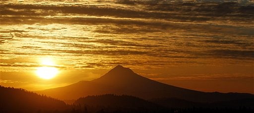 &lt;p&gt;The sun rises over Mount Hood in Portland, Ore. on Thursday, March 8, 2012. The largest solar storm in five years has engulfed Earth, but scientists say the planet has lucked out so far. The storm arrived more peacefully Thursday morning than it could have. Scientists say that could change as the storm spends the day shaking the planet's magnetic field. It could disrupt technology but also spread colorful Northern Lights. (AP Photo/Rick Bowmer)&lt;/p&gt;