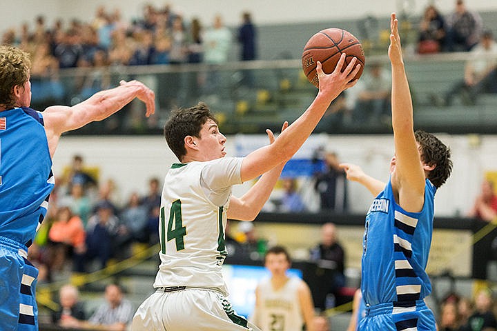 &lt;p&gt;Jake Sieler, of St. Maries, takes a shot over a West Jefferson defender in the second half on Saturday.&lt;/p&gt;