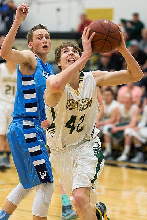 &lt;p&gt;St. Maries High School&#146;s AJ Becktel drives past a West Jefferson defender in the third period.&lt;/p&gt;