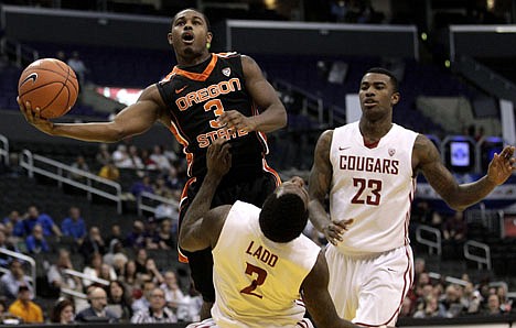 &lt;p&gt;Oregon State's Ahmad Starks(3) drives to the basket against Washington State's Mike Ladd (2) and D.J. Shelton during the second half of an NCAA college basketball game at the Pac-12 Conference tournament in Los Angeles, Wednesday, March 7, 2012. Oregon State won 69-64. (AP Photo/Jae C. Hong)&lt;/p&gt;