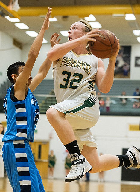 <p>St. Maries High Schools Matthew Smith soars into the air for a shot in the second quarter against West Jefferson.</p>