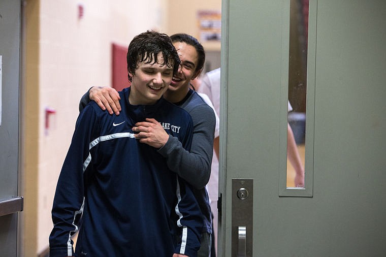 &lt;p&gt;Jerry Louie-McGee hugs Justin Pratt as they walk to the locker room after Lake City beat Rocky mountain.&lt;/p&gt;