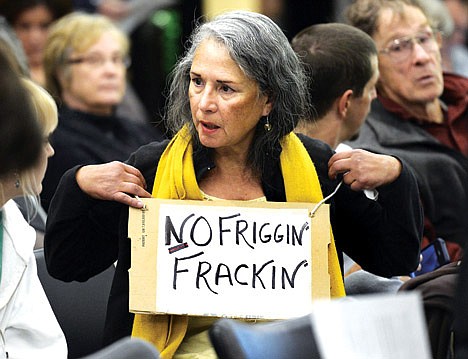 &lt;p&gt;In this Dec. 13, 2012 file photo, Elizabeth Allen of Boulder, Colo., wears a &quot;No Friggin' Frackin&quot; sign while waiting for a public meeting to begin on the oil and gas drilling method known as hydraulic fracturing, or &quot;fracking,&quot; at the Boulder County Courthouse in Boulder, Colo.&lt;/p&gt;