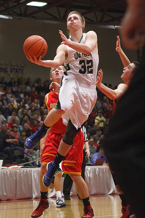 <p>Glacier senior guard Matt Peters (32) lays the ball up Friday afternoon during Glacier's matchup against Hellgate on the second day of the Class AA state basketball tournament at Four Seasons Arena in Great Falls. Friday, March 8, 2013 in Great Falls, Montana. (Patrick Cote/Daily Inter Lake)</p>