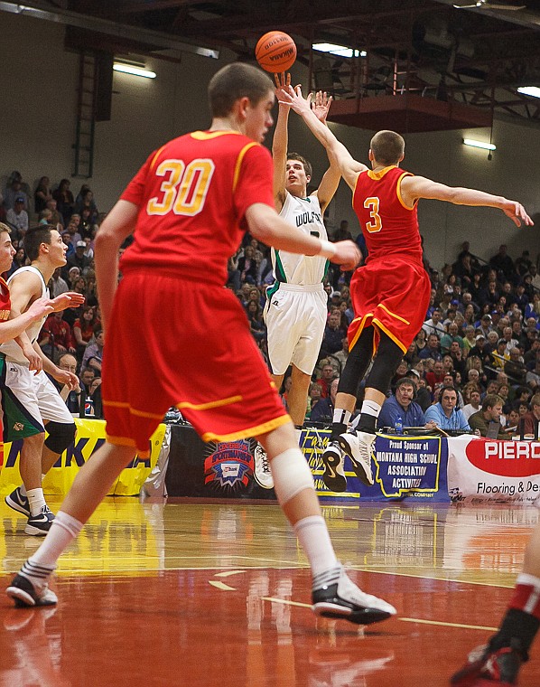 <p>Glacier senior guard Reid Siderius (3) makes a three-point shot Friday afternoon during Glacier's matchup against Hellgate on the second day of the Class AA state basketball tournament at Four Seasons Arena in Great Falls. Friday, March 8, 2013 in Great Falls, Montana. (Patrick Cote/Daily Inter Lake)</p>
