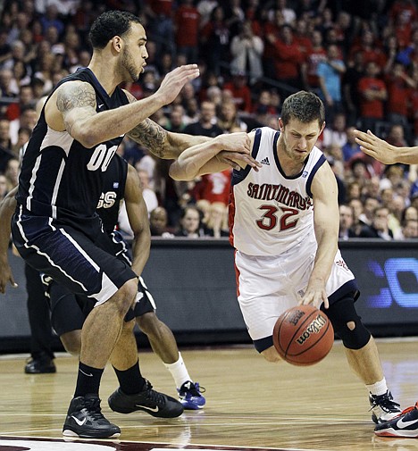 &lt;p&gt;Saint Mary's Mickey McConnell (32) drives to the lane against Gonzaga's Robert Sacre in the first half of the West Coast Conference Tournament championship game Monday in Las Vegas.&lt;/p&gt;