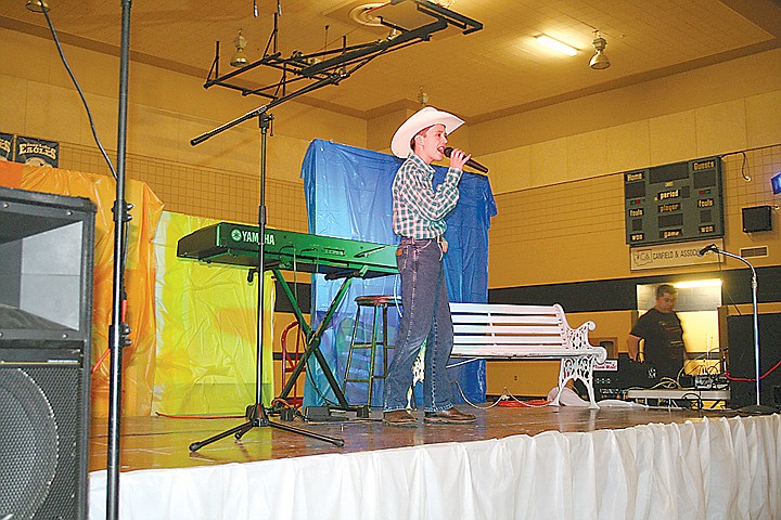 Kameron Goetz warms up for his performance at the 2011 Byway Idol contest. Goetz won first in the juniors category and $500 for his performance of &quot;Long Black Train&quot; on Saturday.