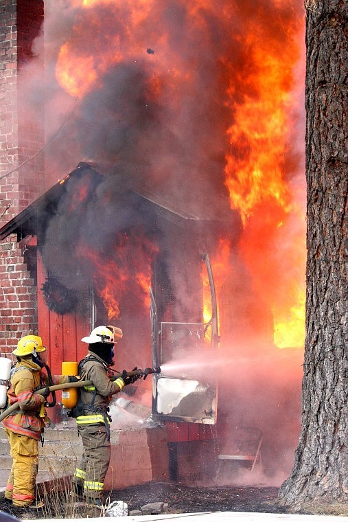 &lt;p&gt;Plains-Paradise Rural (yellow suit, left) and Plains City (tan suit, right) Volunteer firefighters work together to smother the flames March 8 at t a house fire on Montana highway 135 just outside of Paradise. Authorities deemed the structure a total loss.&lt;/p&gt;