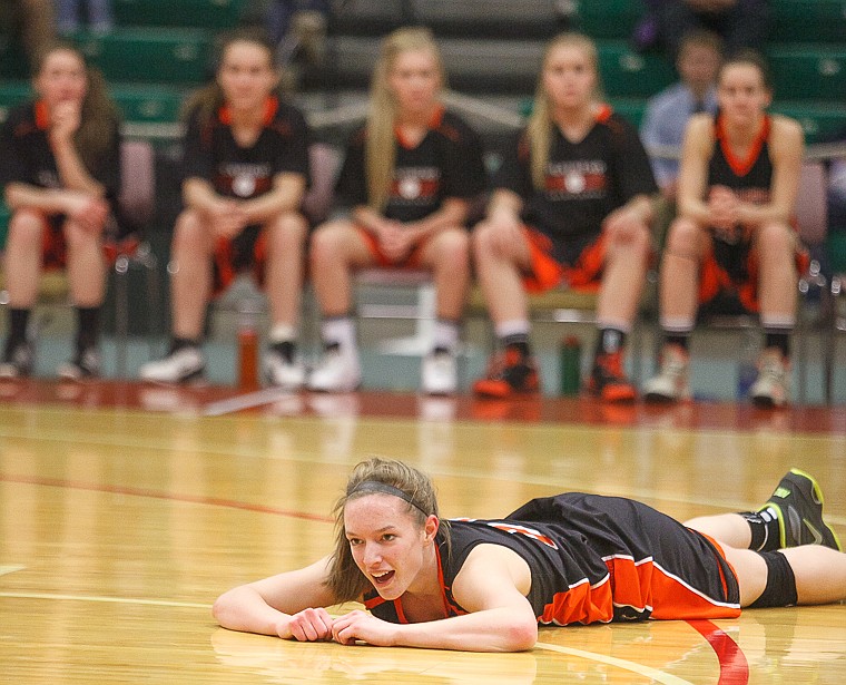 &lt;p&gt;Flathead senior Emily Russell (15) lays on the ground after being fouled Friday afternoon during Flathead's matchup against Billings Senior on the second day of the Class AA state basketball tournament at Four Seasons Arena in Great Falls. Friday, March 8, 2013 in Great Falls, Montana. (Patrick Cote/Daily Inter Lake)&lt;/p&gt;