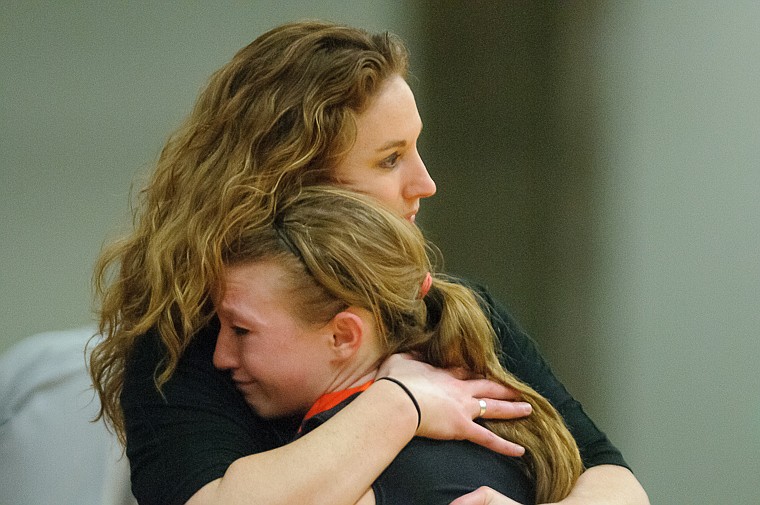 &lt;p&gt;Head coach Karly Tait hugs Flathead senior Dani Davis (11) after she fouled out of the game Friday afternoon during Flathead's matchup against Billings Senior on the second day of the Class AA state basketball tournament at Four Seasons Arena in Great Falls. Friday, March 8, 2013 in Great Falls, Montana. (Patrick Cote/Daily Inter Lake)&lt;/p&gt;