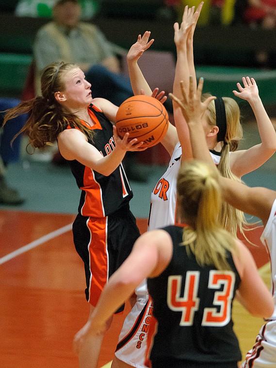 &lt;p&gt;Flathead senior Dani Davis (11) puts up a shot underneath the basket Friday afternoon during Flathead's matchup against Billings Senior on the second day of the Class AA state basketball tournament at Four Seasons Arena in Great Falls. Friday, March 8, 2013 in Great Falls, Montana. (Patrick Cote/Daily Inter Lake)&lt;/p&gt;