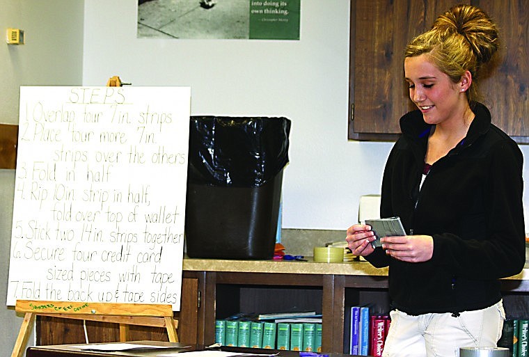 &lt;p&gt;4-H student Nicole Rehbein demonstrating to the judges how to make a wallet out of duct tape for her presentation at Hot Springs High School.&lt;/p&gt;