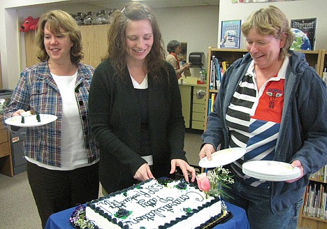 &lt;p&gt;Patty Morrison, center, Spirit Lake Elementary principal, cuts a cake recognizing her as the Idaho Gem Award for Rookie Administrator recipient from the Idaho Association of Elementary School Principals. Joining her is fifth-grade teacher Lori Clark, left, and head custodian Vicki Buchert.&lt;/p&gt;