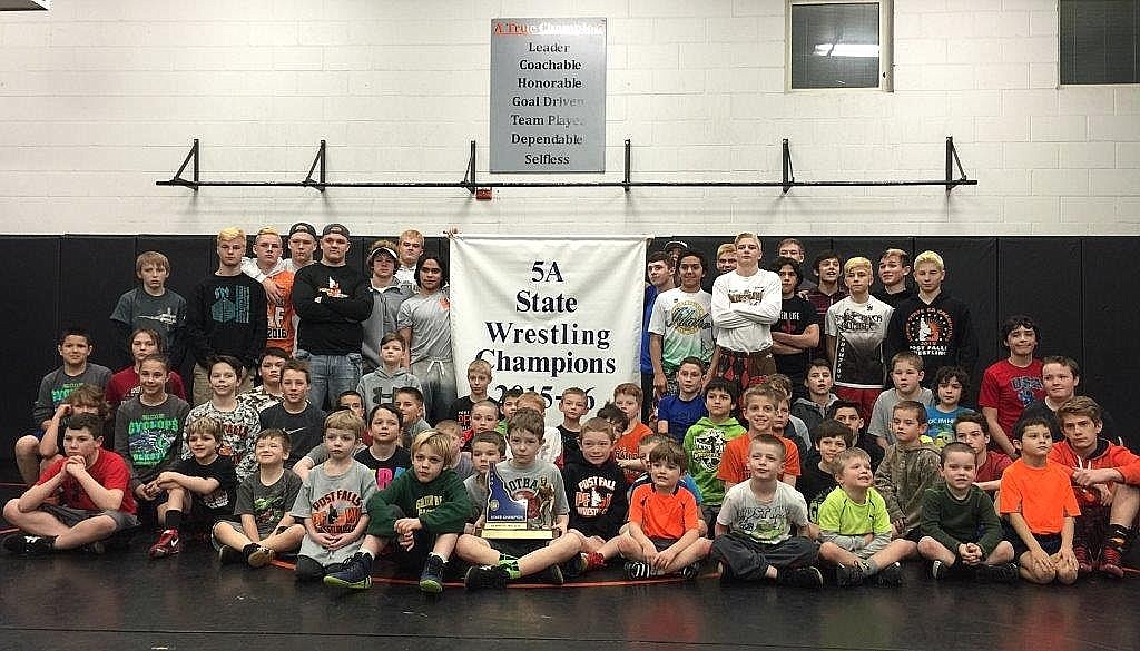 &lt;p&gt;Courtesy photo&lt;/p&gt;&lt;p&gt;Members of the Post Falls High School wrestling team paid a visit to a Team Real Life wrestling practice last week to show the younger wrestlers the Idaho state 5A wrestling championship team trophy and banner they had just earned as back to back state champions. Many of the high schoolers that have placed in or won championships for Post Falls High School at the state tournament got their starts with Team Real Life wrestling. Coach Pete Reardon offered the younger wrestlers words of encouragement about the dedication, sacrifice and hard work needed to be a successful student athlete and a successful adult. Senior and four-time state champion Alius De La Rosa and senior and two-time state champion Tyler Wolf offered more encouragement to their younger counterparts about the worthiness and benefits of the sport. Several of the high schoolers also shared stories with the Team Real Life wrestlers about their own experiences as Team Real Life wrestlers as they remained at the practice to assist&lt;/p&gt;&lt;p&gt;coaching the youngsters. Post Falls High School championship team members who attended were, standing from left, Jonathon Hill; Tyler Morris; Wyatt Shelly, 6th place; Brad Noesom; Cameron Welker ; Colton Kazmierczak ; Cody Kantrell; holding banner, Alius De La Rosa, four-time state champion; holding banner, Tyler &quot;TJ&quot; Wolf, two-time state champion; Mathias De La Rosa, 2nd place; Jordan Grimm, 2nd place; Braydon Huber, 2nd place; A.J. De La Rosa, younger brother of Alius and Mathias De La Rosa; David Booth; Matt McLeod, first-time state champion; Ridge Lovett, first-time state champion; Jason Burchell, 4th place and Alessio Lemmon, 5th place. Seated in front is Team Real Life.&lt;/p&gt;