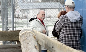 Plains' Mayor Mike Brinson was at the Plains community pool on Thursday morning meeting with Jenifer Reynolds, the chair of the Parks and Recreation committee, center, and Carl Reeb, the president of the Plains City Council.  They discussed the work being done by volunteers on the pool's filter, and whether it will be able to open by June.