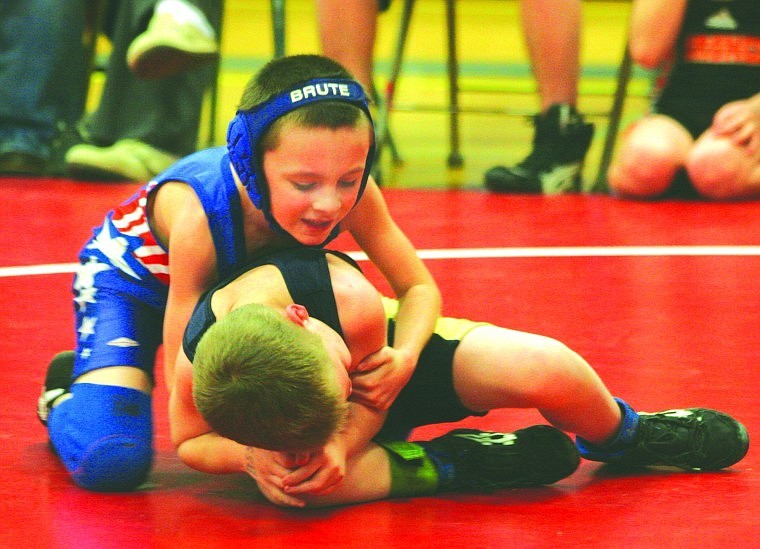 Ethan Kelsey starts to control the match as he gets on top of his opponent during Thursday's wresting meet.